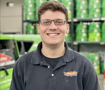 Male standing in front of SERVPRO equipment